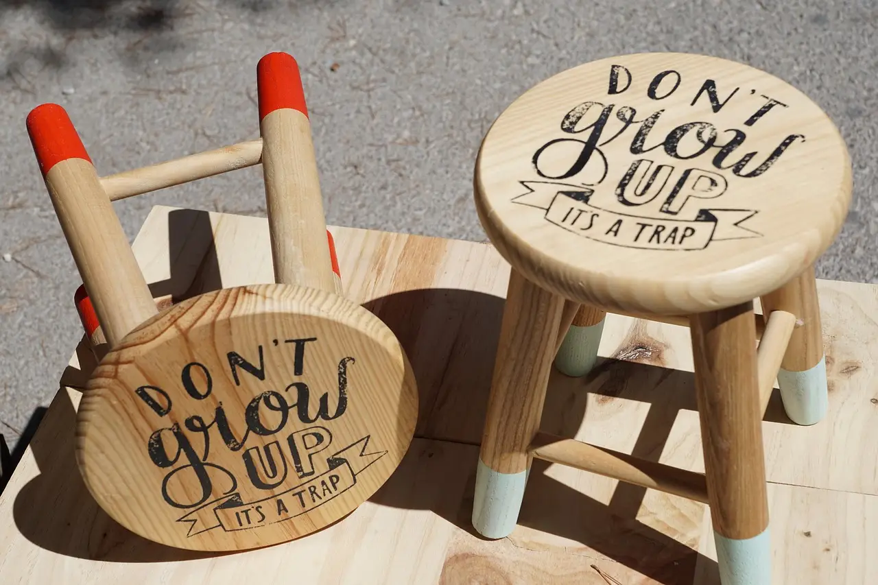 1930s cider press screw becomes sculptural stool in reclaimed wood and brushed aluminum